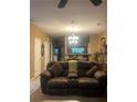 Living room with a view of the kitchen, showcasing an open floor plan at 7324 Bridlewood Ct, Jonesboro, GA 30236