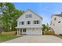 Charming two-story home with white siding, gray shutters, and a well-manicured lawn at 1576 Hawthorne Se Ave, Smyrna, GA 30080