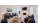 Sophisticated living room with fireplace, stylish furniture, and elegant decor at 59 Saint Claire Ne Ln, Atlanta, GA 30324