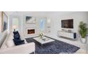 Bright and spacious living room featuring a white fireplace, modern decor and comfortable seating at 59 Saint Claire Ne Ln, Atlanta, GA 30324