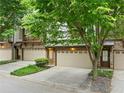 Desirable townhome exhibiting lovely landscaping, attached garages, and convenient street access at 3231 Chutney Ct, Avondale Estates, GA 30002