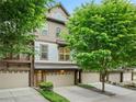 Inviting townhome features neutral colors, attached garages, lush trees, and a welcoming facade at 3231 Chutney Ct, Avondale Estates, GA 30002