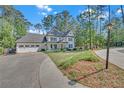 Well-maintained two-story home featuring an attached garage and a neatly manicured lawn at 4985 Miller Sw Rd, Lilburn, GA 30047