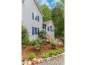 Well-maintained front yard features landscaping and stairs to entrance at 204 Queensbury Ct, Acworth, GA 30102