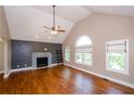 Spacious living room with high ceilings, a fireplace, and large windows at 219 Brick Mill Dr, Canton, GA 30115