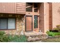 Close up front entry of home featuring a stone facade, decorative windows, and stone steps at 140 N Star Sw Trl, Atlanta, GA 30331