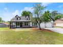 A beautiful two-story home boasts a charming front porch and a practical two-car garage, perfect for families at 2979 Overwood Sw Ln, Snellville, GA 30078