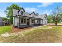 Inviting two-story home with a cozy porch and a two-car garage, nestled on a landscaped lot at 2979 Overwood Sw Ln, Snellville, GA 30078