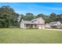 Well-maintained home with a sprawling lawn, perfect for outdoor activities and Gathering enjoyment at 4326 Megan Manor Sw Dr, Powder Springs, GA 30127