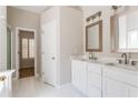 Bright bathroom with a double vanity, white cabinets, and large mirrors at 1115 Third St, Stone Mountain, GA 30083