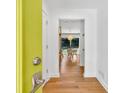 Welcoming entrance featuring hardwood floors and a bright door leading to a naturally lit dining area at 2991 Windfield Cir, Tucker, GA 30084