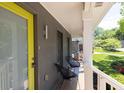 Inviting front porch with modern seating, a bright door, and stylish accents, perfect for relaxing outdoors at 2991 Windfield Cir, Tucker, GA 30084