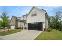The two-car garage and driveway are great features of this beautiful home at 704 Fairlane Dr, Marietta, GA 30064