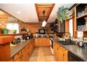 Well-equipped kitchen with wooden cabinets, tile floor, and plenty of counter space at 20 Mahan Ne Ln, Rydal, GA 30171