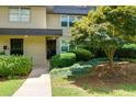 A ground-level shot of a building with a meticulously kept lawn and tidy hedge at 301 Lakemoore Ne Dr # B, Atlanta, GA 30342