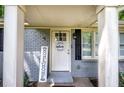Close-up of front door with grey brick and welcome sign at 3710 Lavilla Dr, Powder Springs, GA 30127