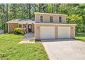 Well-maintained two story home with a 2 car garage and an inviting front lawn at 5379 Winslow Xing, Lithonia, GA 30038