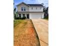 Charming two-story home with a two-car garage and a well-manicured front lawn at 713 Dove Tree Ln, Social Circle, GA 30025