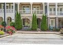 Charming townhouse with brick accents, tidy landscaping, and inviting front porch at 963 Forrest St, Roswell, GA 30075