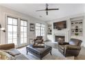 Inviting living room features a fireplace, built-in shelves, and lots of natural light at 963 Forrest St, Roswell, GA 30075