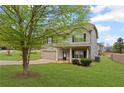 Charming two-story home with gray siding, black shutters, and a well-maintained front yard at 577 Joneus Dr, Mcdonough, GA 30252