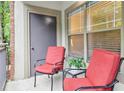 Cozy balcony area with comfortable seating, perfect for enjoying outdoor relaxation and neighborhood views at 5559 Glenridge Dr # 1103, Sandy Springs, GA 30342