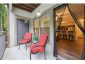 Outdoor patio with view into kitchen, complete with chairs and small table, creating an inviting and functional area at 5559 Glenridge Dr # 1103, Sandy Springs, GA 30342
