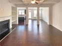 Spacious open-concept living area with hardwood floors and lots of natural light at 7526 Stone Creek Path, Lithonia, GA 30038
