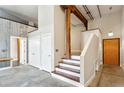 Stairway leading up to the next level with a hallway and two doorways at 350 Peters Sw St # 6, Atlanta, GA 30313