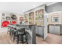 Finished basement featuring a custom bar with seating, sports memorabilia, and a full sink at 2292 W Village Junction Se Way, Smyrna, GA 30080