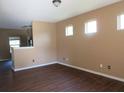 Inviting living room with modern wood floors and an abundance of natural light at 6069 Semaphore Rdg, Rex, GA 30273