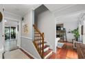 Inviting home entryway featuring hardwood floors and a staircase with wood banisters at 2910 Edwards Ct, Marietta, GA 30068