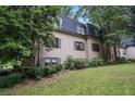 Charming exterior view of a townhome on a lush lawn, creating a serene and inviting ambiance at 170 Elysian Nw Way, Atlanta, GA 30327
