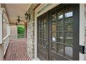 Elegant stone-accented entrance with double doors and a brick porch, creating a grand welcome at 1888 Sever Creek Cir, Lawrenceville, GA 30043