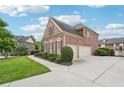 Charming brick home featuring a well-maintained lawn and a convenient two-car garage at 1888 Sever Creek Cir, Lawrenceville, GA 30043