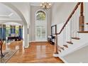 Gracious foyer boasting hardwood floors, soaring ceilings, and an abundance of natural light at 5335 Davenport Mnr, Cumming, GA 30041