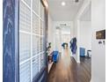 Inviting foyer with hardwood floors, natural light, and a glimpse into the open-concept living spaces at 529 Azalea Bloom Dr, Loganville, GA 30052