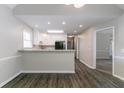 Small kitchen with recessed lighting, white cabinets, and wood-look flooring at 2950 Camary Place Se Dr, Conyers, GA 30094