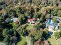 Expansive aerial view of the estate with lush landscaping, mature trees, and neighboring luxury properties at 15 Cherokee Nw Rd, Atlanta, GA 30305