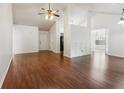 Spacious living room featuring hardwood floors and access to the entry and kitchen area at 672 Bostonian Way, Lawrenceville, GA 30046