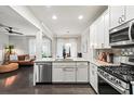 Modern kitchen featuring stainless steel appliances, granite countertops, and hardwood floors at 2450 Norwood Park Xing, Atlanta, GA 30340