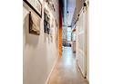 Hallway with gallery wall and sliding barn door, showcasing the home's unique character at 170 Boulevard # H201, Atlanta, GA 30312