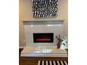 Modern fireplace with a sleek white mantle and decorative tile surround, adding a touch of elegance at 1740 Emerald Ave Ave, Atlanta, GA 30310