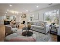 Cozy living room with fireplace, hardwood floors, and plenty of natural light at 3226 Custer Lake Nw Dr, Marietta, GA 30064