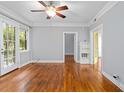 Inviting living area with hardwood flooring, ceiling fan, and an open doorway to another room at 677 Somerset Ne Ter # C6, Atlanta, GA 30306