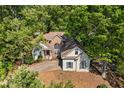 A serene house surrounded by lush greenery, offering privacy and tranquility at 115 Stonewall Dr, Covington, GA 30016