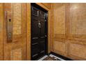 Apartment entry with black door featuring decorative accents and marbled wall design at 1325 Peachtree Ne St # 401, Atlanta, GA 30309