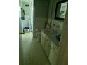 Bathroom featuring a sink with cabinets, a mirror, a toilet, and a shower with tile surround at 2291 Piney Grove Rd, Loganville, GA 30052