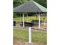 Community gazebo with multiple picnic tables and charcoal grills, perfect for outdoor dining and gatherings at 6397 Autumn View Nw Trce, Acworth, GA 30101