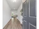 Inviting foyer with hardwood floors, leading to a spacious living area with natural light at 2091 Landsburg Way, Lawrenceville, GA 30043